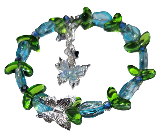 Glass Bead Bracelet- Adjustable blue tulip with green leaves and butterfly charm